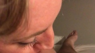 Spitting on my hard cock. Taking it deep down her throat