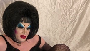 Horny Drag Queen plays with anal beads, licks them clean